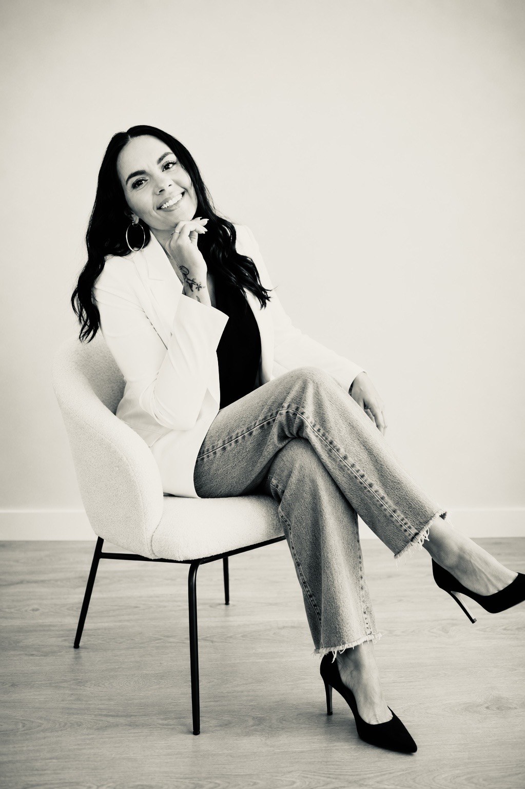 Vanessa Smith, founder of Catwalk Advisory, seated in a quiet studio in a black and white editorial portrait